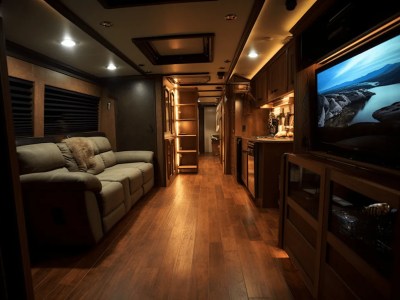 Inside A Rv With Hardwood Flooring And Television