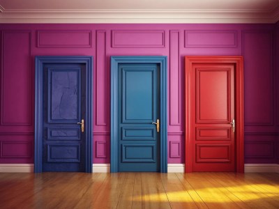 Three Colorful Doors In An Empty Interior With Blue Walls