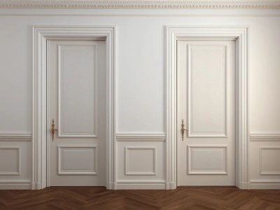 Two Wooden Doors In The Same Room, With White Walls And Hardwood Floors